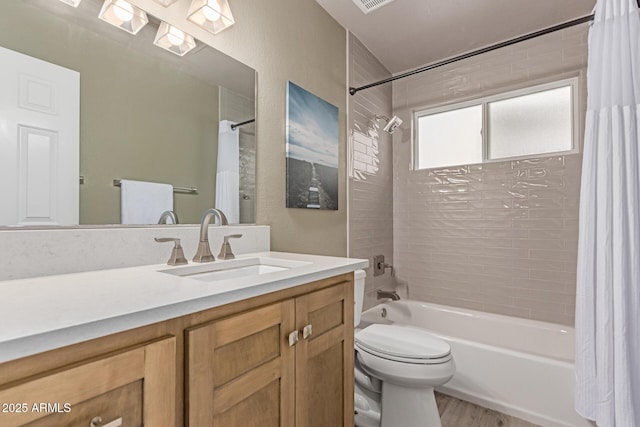 24813 N 55th Dr, Glendale, AZ 85310 - bathroom featuring shower / bath combo with shower curtain, vanity, toilet, and wood finished floors