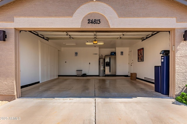 24813 N 55th Dr, Glendale, AZ 85310 - garage with fridge with ice dispenser, water heater, and driveway