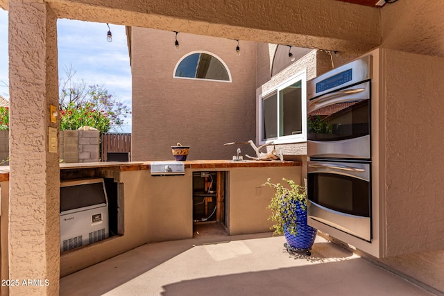24813 N 55th Dr, Glendale, AZ 85310 - view of patio with an outdoor kitchen