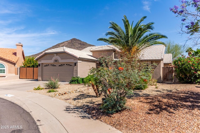 24813 N 55th Dr, Glendale, AZ 85310 - view of front of home with stucco siding, a tile roof, driveway, and an attached garage