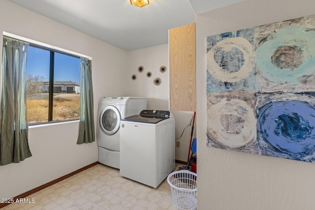 laundry room with laundry area, baseboards, light floors, and independent washer and dryer