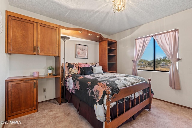 bedroom featuring light carpet, baseboards, and a textured ceiling