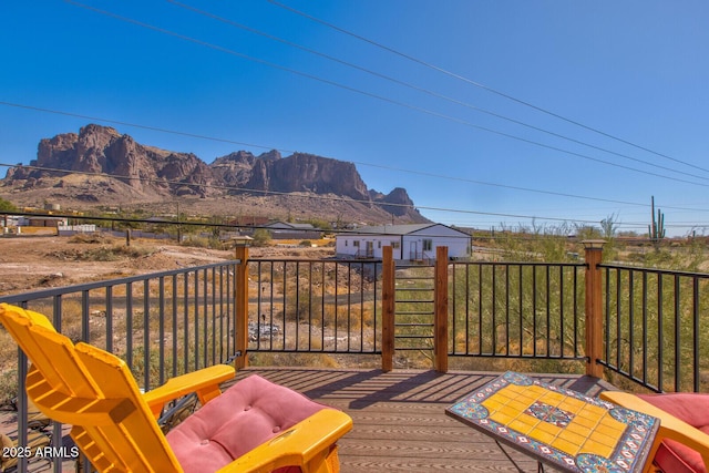 wooden deck featuring a mountain view