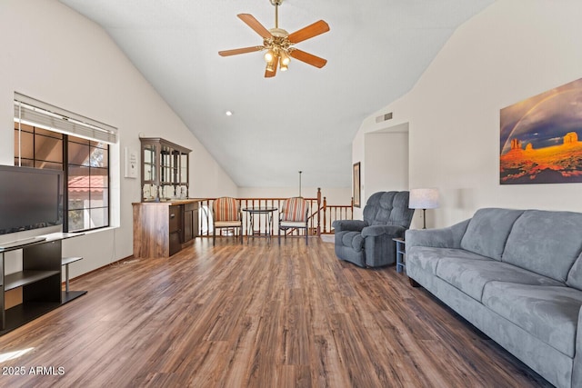 living room with ceiling fan, visible vents, vaulted ceiling, and wood finished floors