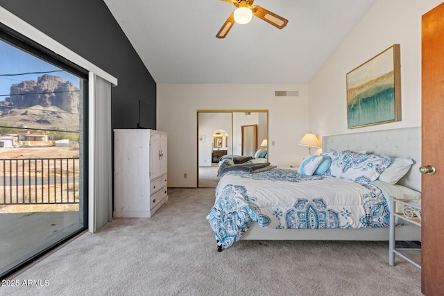 bedroom with lofted ceiling, access to outside, light carpet, and visible vents