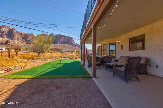 exterior space featuring a patio area and a mountain view