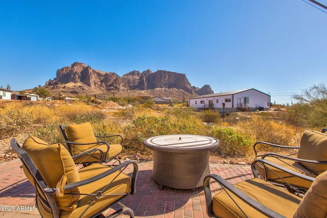 view of patio / terrace featuring a mountain view