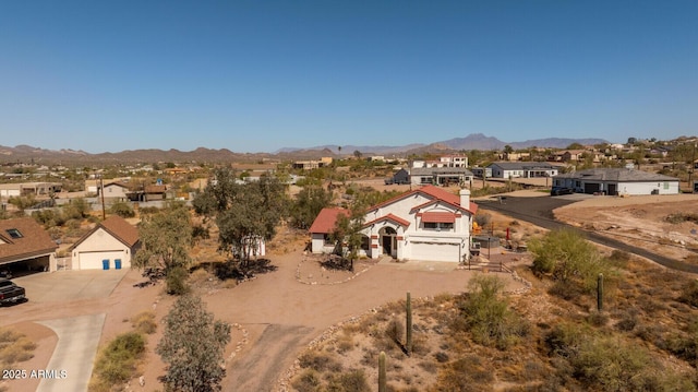 birds eye view of property with a residential view and a mountain view