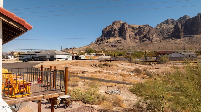 view of yard with a mountain view and fence