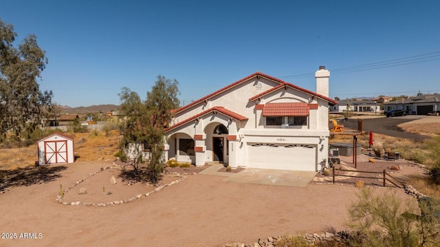 view of front facade featuring a chimney, stucco siding, an attached garage, driveway, and a tiled roof