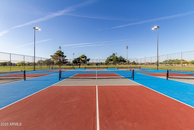 view of sport court featuring community basketball court and fence
