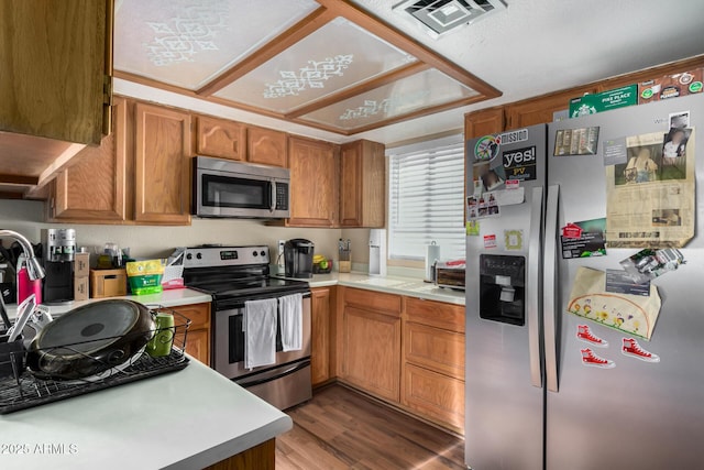 kitchen featuring light countertops, visible vents, and appliances with stainless steel finishes