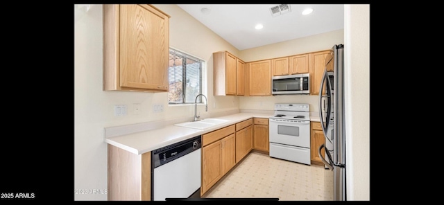 1869 E Birch St, Casa Grande, AZ 85122 - kitchen with light countertops, light brown cabinets, appliances with stainless steel finishes, and a sink