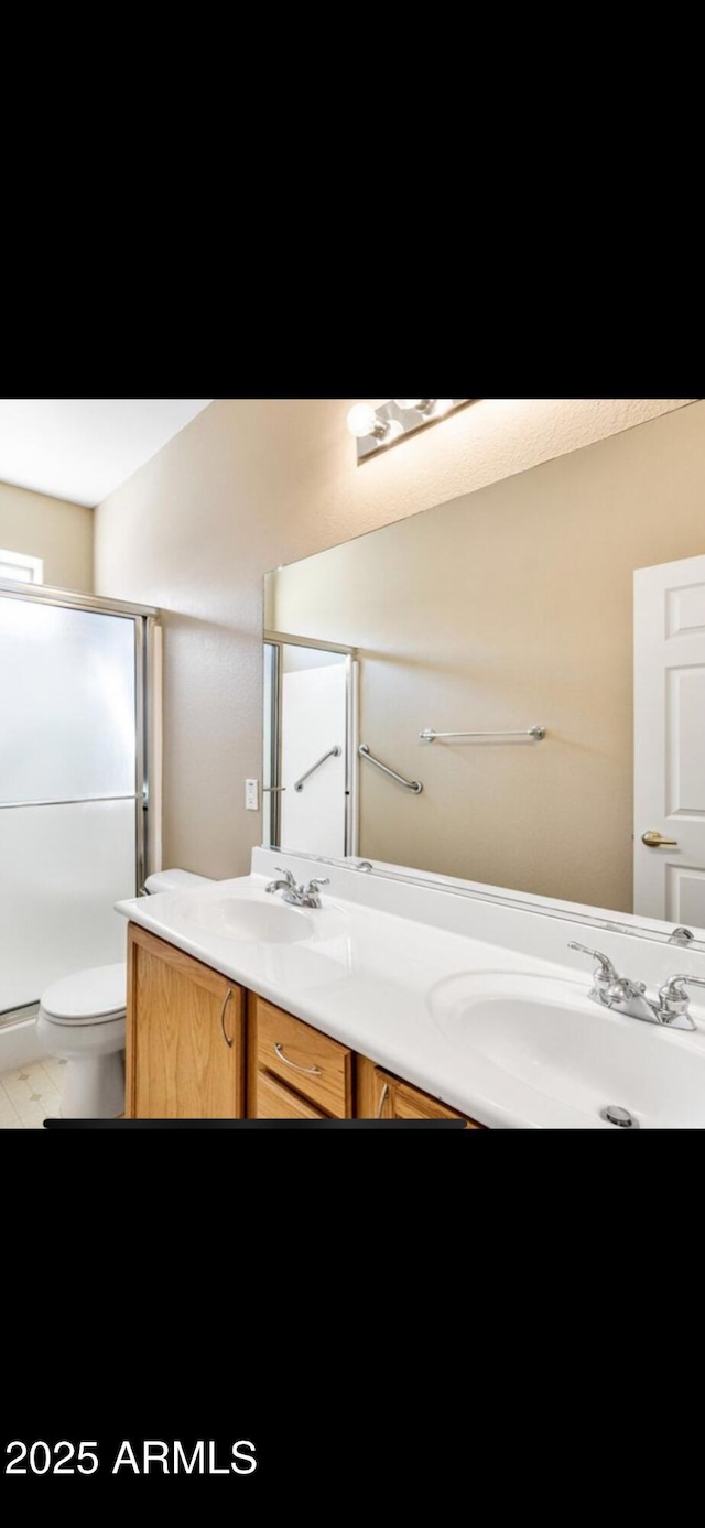 1869 E Birch St, Casa Grande, AZ 85122 - full bathroom with a sink, double vanity, toilet, and a stall shower
