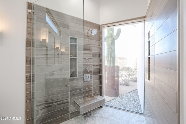 bathroom with tiled shower