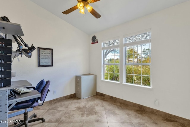 tiled home office featuring ceiling fan and vaulted ceiling