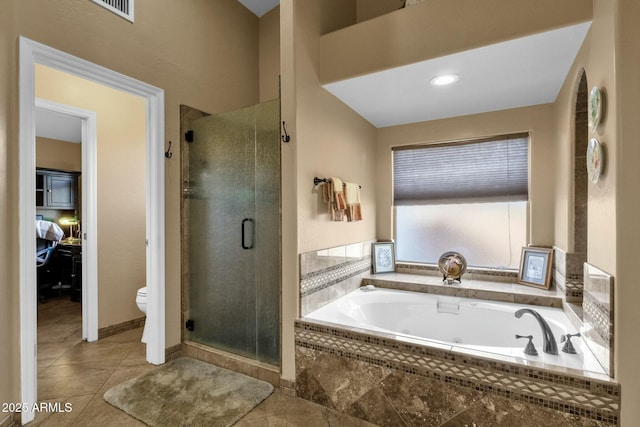 bathroom featuring tile patterned floors, independent shower and bath, and toilet