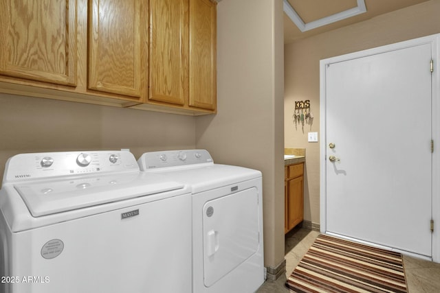 laundry area with cabinets and washer and dryer