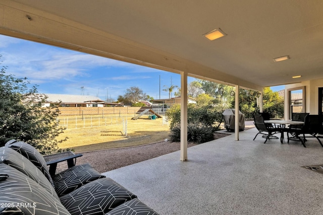 view of patio / terrace featuring a playground and grilling area