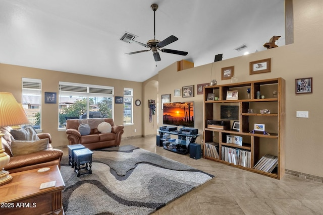 living room with ceiling fan and high vaulted ceiling