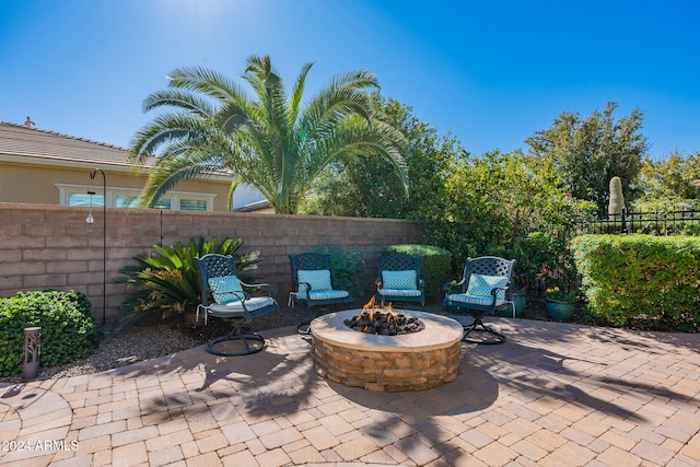 view of patio / terrace featuring an outdoor fire pit