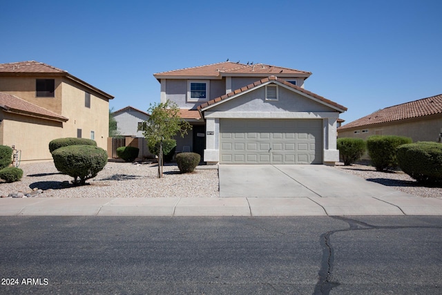1706 W Coolidge Way, Coolidge, AZ 85128 - traditional-style home featuring a tiled roof, stucco siding, driveway, and a garage