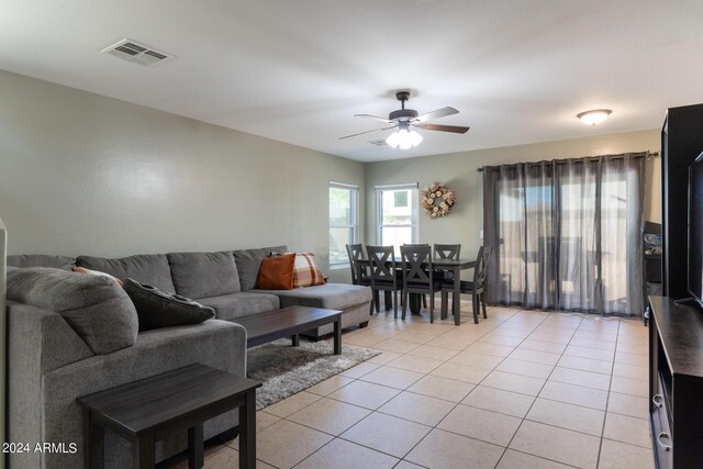 1706 W Coolidge Way, Coolidge, AZ 85128 - living area with light tile patterned flooring, a ceiling fan, and visible vents