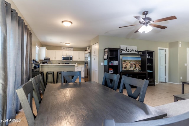 1706 W Coolidge Way, Coolidge, AZ 85128 - dining space with baseboards, a ceiling fan, and light tile patterned floors
