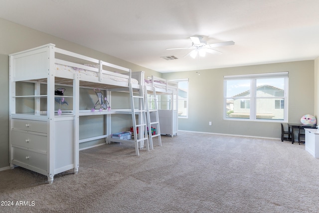 unfurnished bedroom with carpet floors and ceiling fan