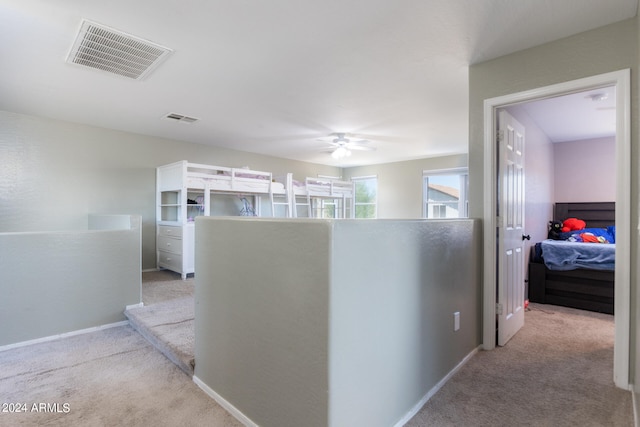 corridor with light colored carpet