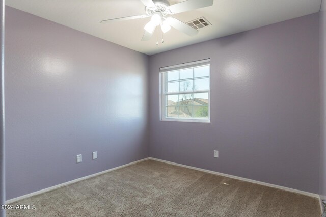 1706 W Coolidge Way, Coolidge, AZ 85128 - unfurnished room with a ceiling fan, baseboards, visible vents, and carpet