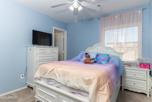 bedroom with ceiling fan and light colored carpet