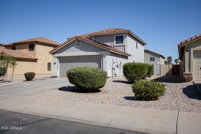1706 W Coolidge Way, Coolidge, AZ 85128 - view of front of property featuring a garage, fence, stucco siding, concrete driveway, and a tile roof