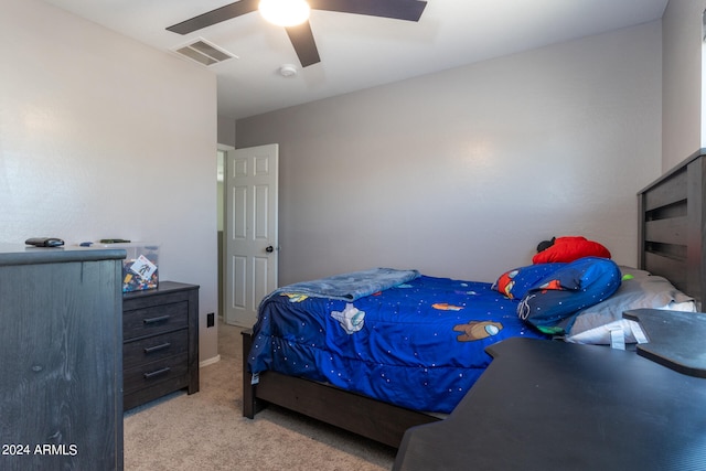 bedroom featuring light carpet and ceiling fan