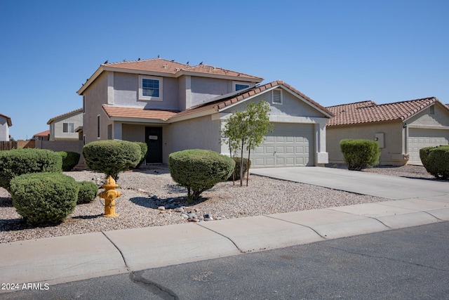 1706 W Coolidge Way, Coolidge, AZ 85128 - view of front of house featuring a garage, stucco siding, driveway, and a tile roof