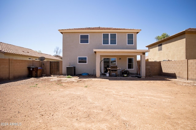 1706 W Coolidge Way, Coolidge, AZ 85128 - back of house featuring central air condition unit, a patio, a fenced backyard, and stucco siding