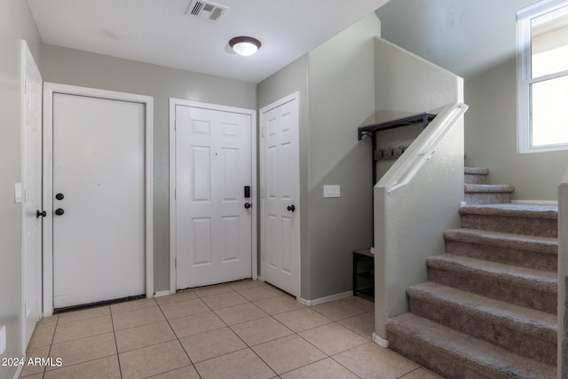 1706 W Coolidge Way, Coolidge, AZ 85128 - foyer featuring stairs, baseboards, visible vents, and light tile patterned floors