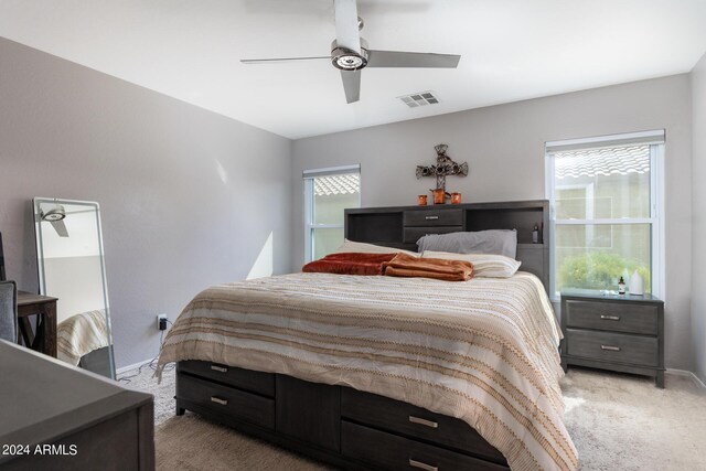 1706 W Coolidge Way, Coolidge, AZ 85128 - bedroom with a ceiling fan, baseboards, visible vents, and light carpet