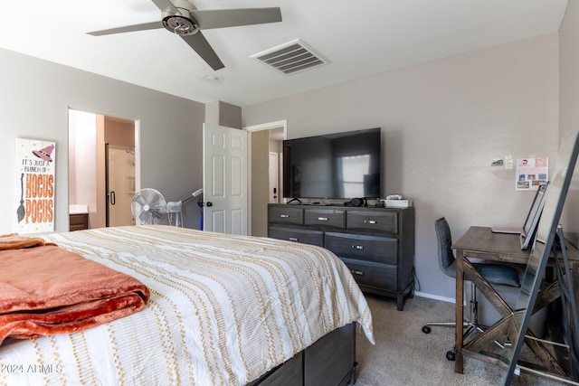 bedroom featuring ceiling fan, connected bathroom, and carpet