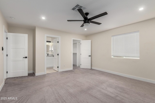unfurnished bedroom with light colored carpet, visible vents, recessed lighting, and baseboards