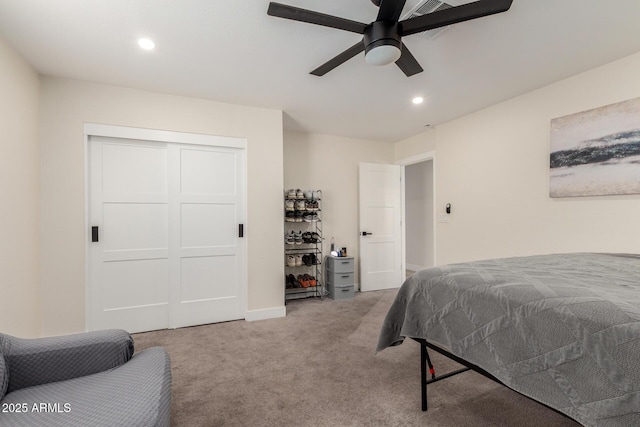 bedroom with light carpet, a closet, ceiling fan, and recessed lighting