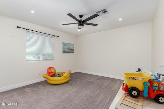 game room featuring carpet, baseboards, ceiling fan, and visible vents