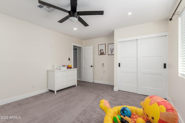 rec room with light colored carpet, recessed lighting, baseboards, visible vents, and a ceiling fan