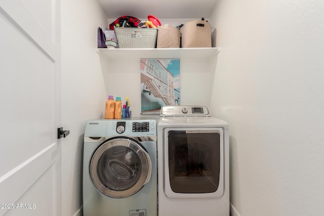 washroom featuring laundry area and separate washer and dryer