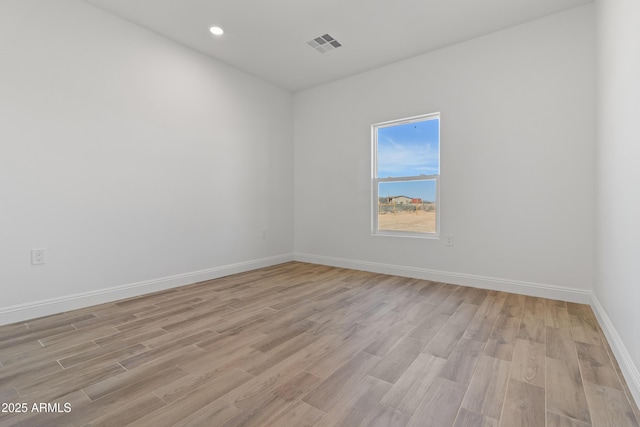 1222 S 365th Ave, Tonopah, AZ 85354 - empty room featuring light wood-style flooring, baseboards, and recessed lighting