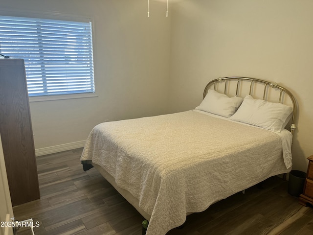 bedroom featuring dark hardwood / wood-style flooring