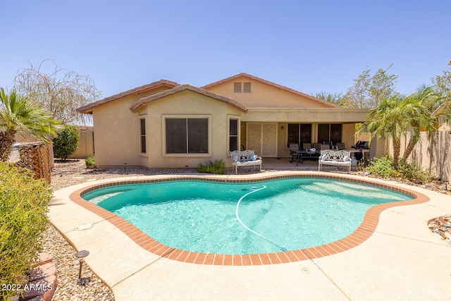 view of pool featuring a patio