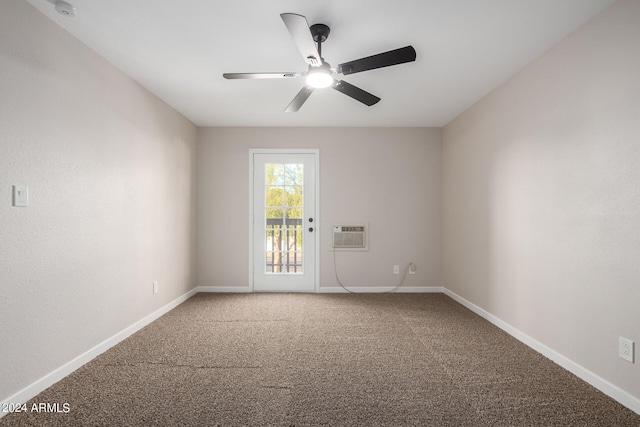 carpeted spare room with ceiling fan and a wall mounted air conditioner