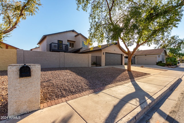 view of front of property with a garage and a balcony