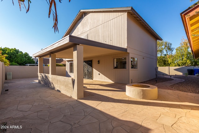 rear view of house featuring a patio